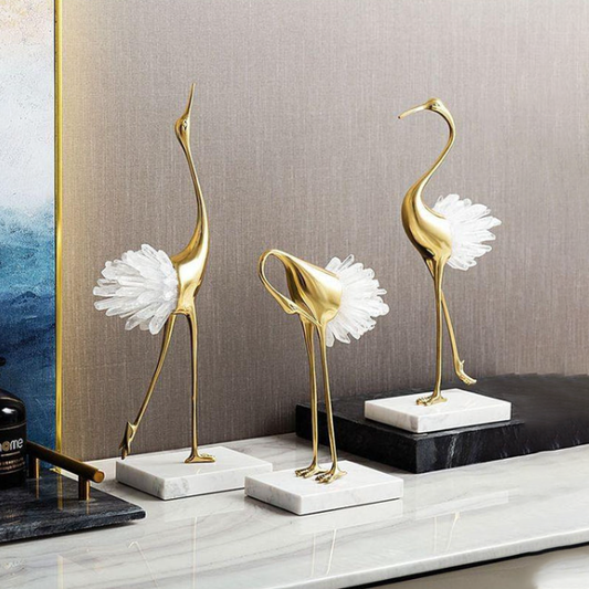 Elegant Gold Crane Sculptures with White Feather Accents
